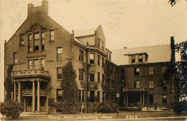 A sepia image of a four-story brick dorm building.