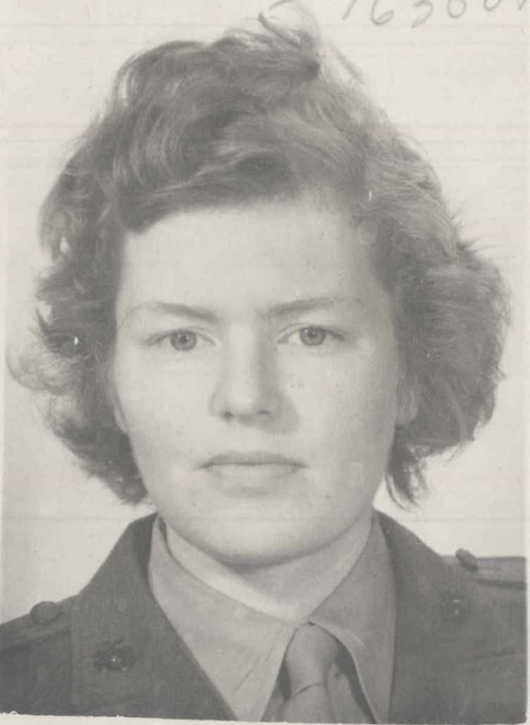 A black and white headshot of a young White female in uniform.