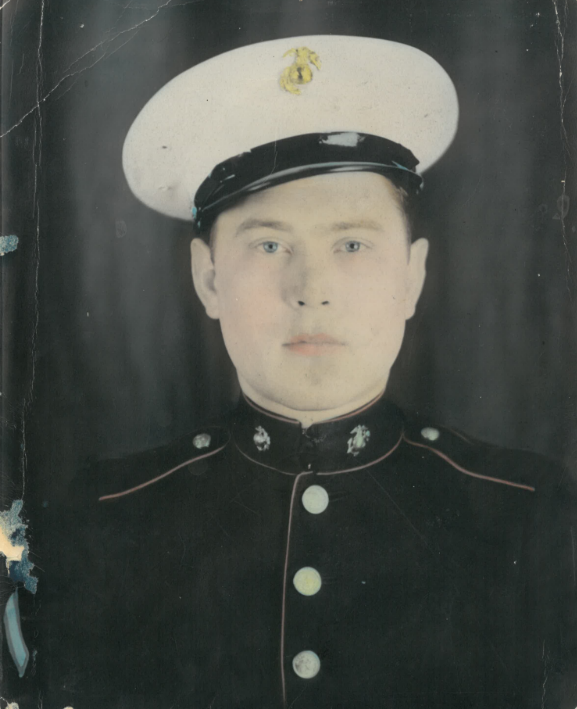 A young man in a Marine Corps dress uniform.