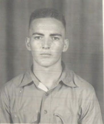 A black and white image of a young White man in uniform.
