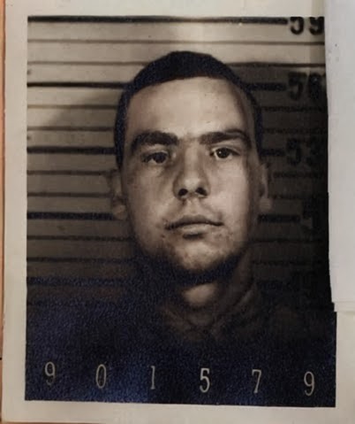 A black and white headshot of a young White man in uniform.