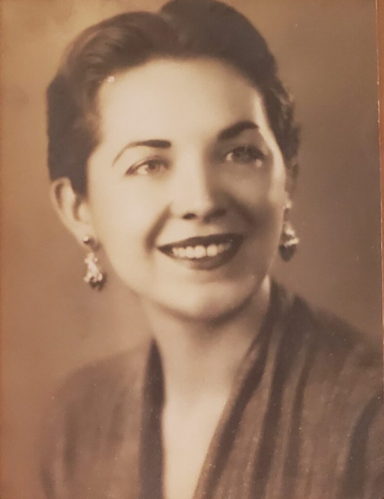 A black and white image of a young White woman.