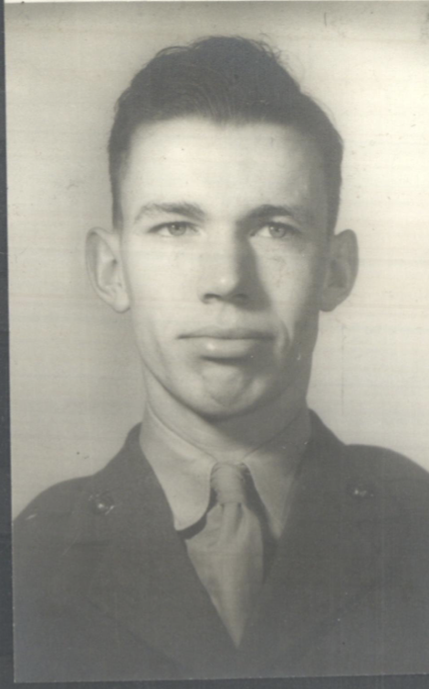 A black and white headshot of a young White man in uniform.