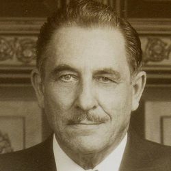 A sepia-toned headshot of an older White male.