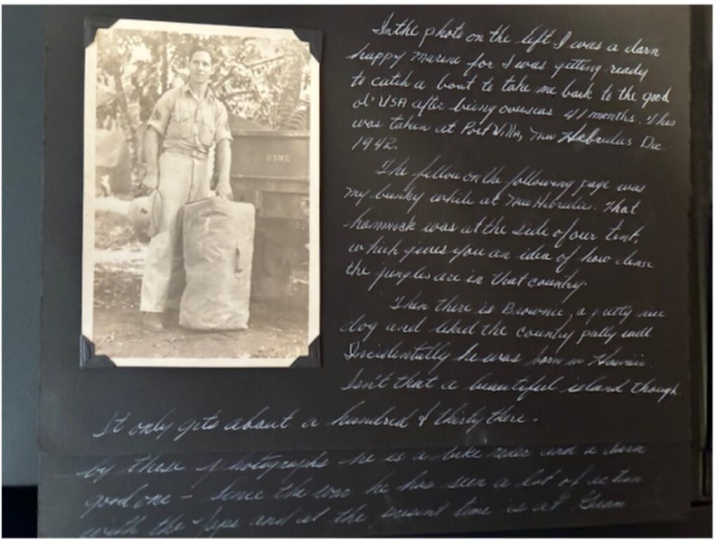 A scrapbook page with cursive writing around a black and white photo of a young White man in uniform standing behind a truck.