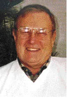 A color headshot of an older White man with glasses.
