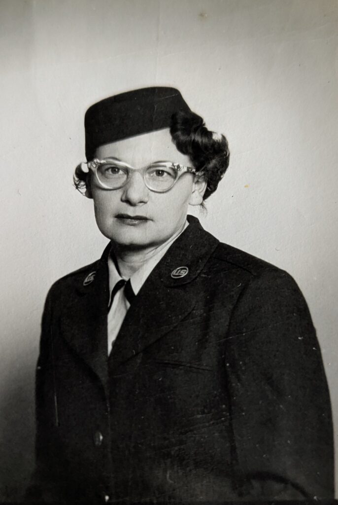 A black and white photo of an older White woman in uniform.