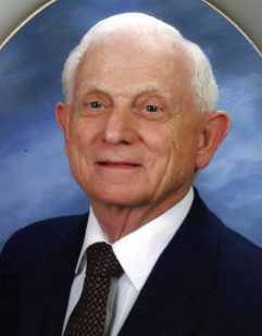 A formal color headshot image of an elderly White man in a suit and tie.