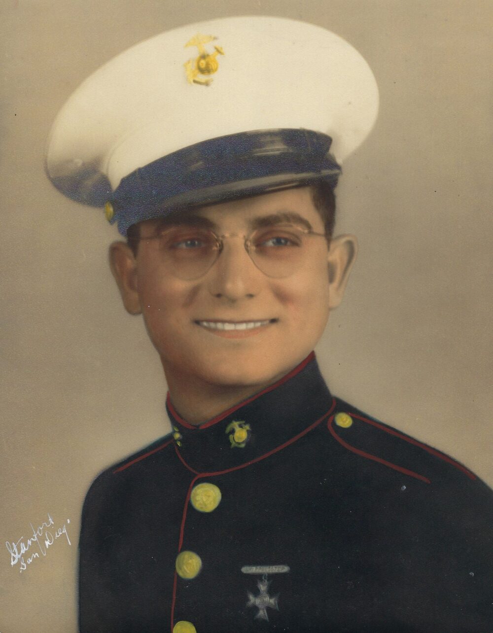 A color image of a young White man in a USMC dress uniform.