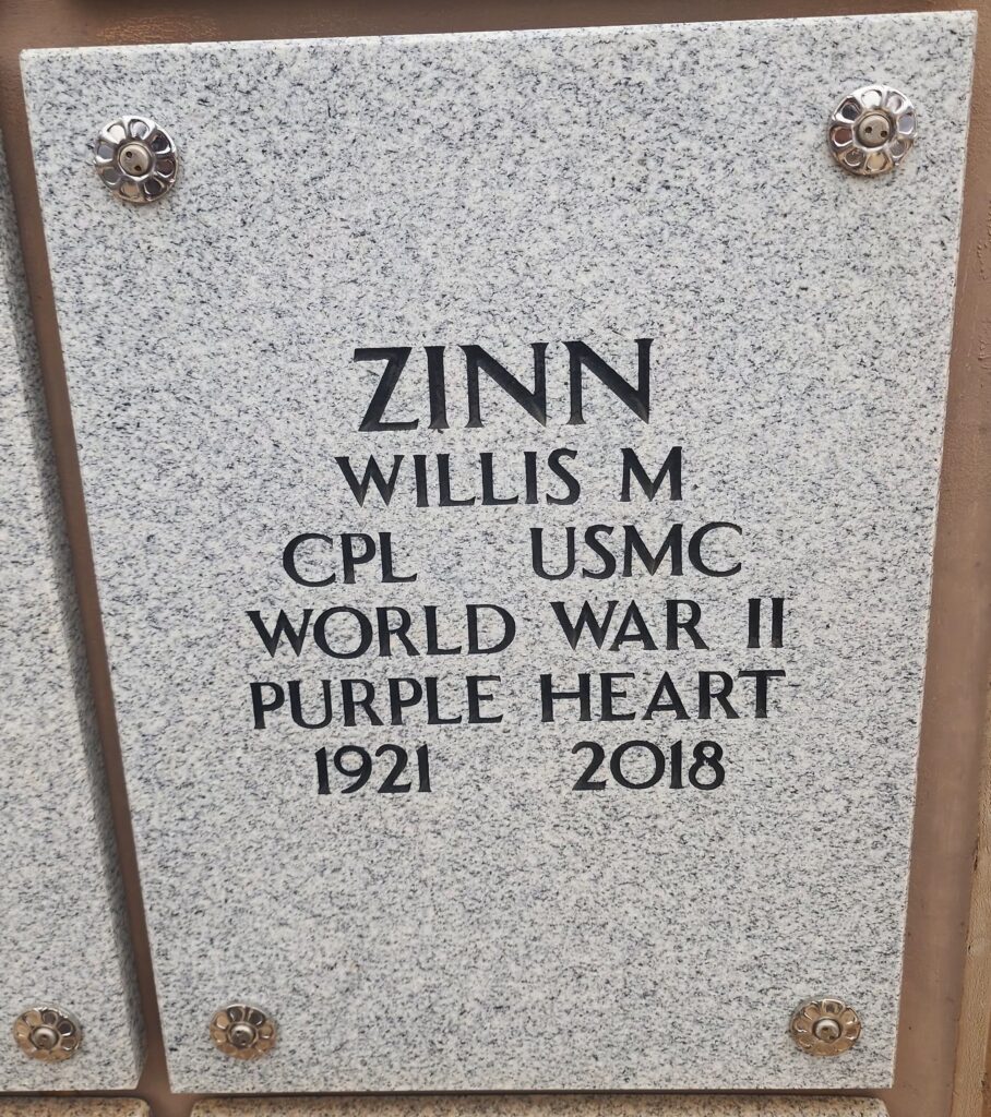 A color image of a gray headstone.