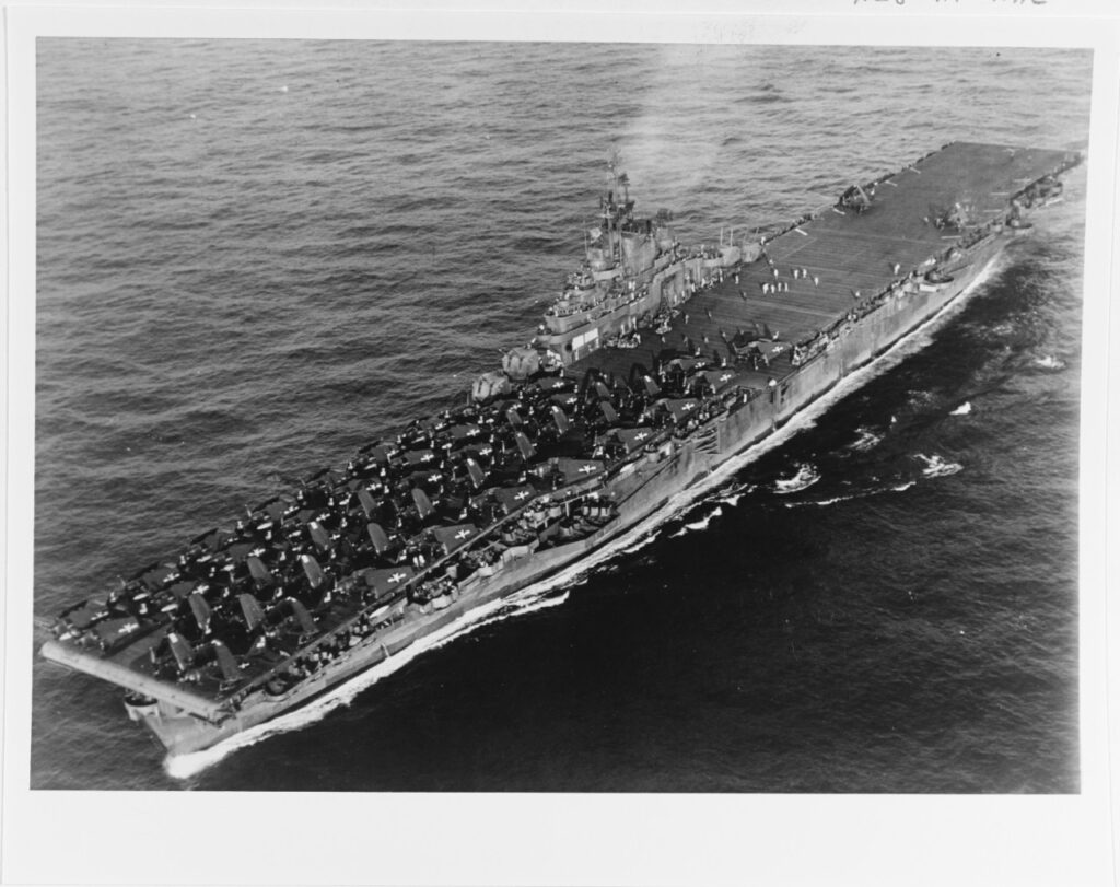 A black and white photo of a large ship in the ocean. 